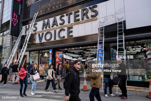 American candy shop on Oxford Street where once stood the flagship HMV record shop with its His Masters Voice sign is covered up and famous dog and...