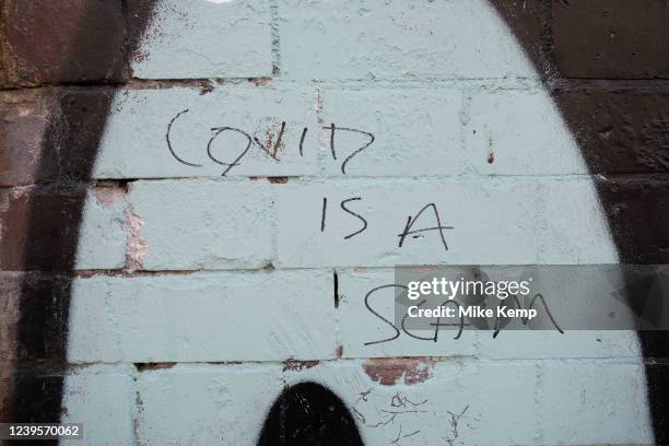 Covid is a scam graffiti on 24th March 2022 in London, United Kingdom.