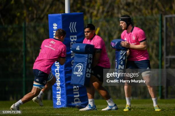 Dublin , Ireland - 28 March 2022; Leinster players, from left, Scott Penny, Michael Ala'alatoa and Jack Dunne during a Leinster Rugby squad training...