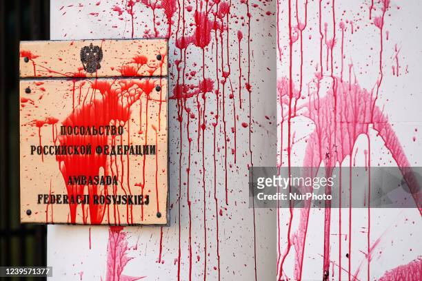 The entrance of the Russian embassy is seen covered in fake blood in Warsaw, Poland on March 28, 2022. Activists threw fake blood on the entrance and...