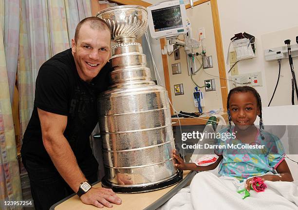 Boston Bruins player Shawn Thornton brings the Stanley Cup to