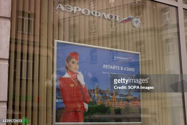 An Aeroflot poster reading âFly to Asiaâ is seen in a storefront of the Aeroflot office in Moscow. Soon after sanctions were imposed on Russia in...
