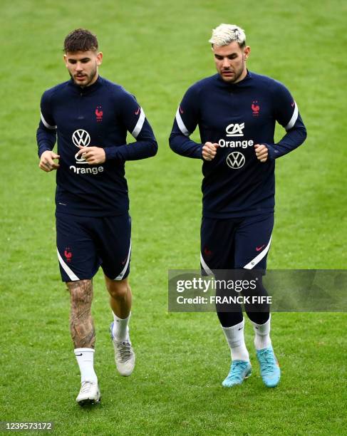 France's defender Lucas Hernandez and Fance's defender Theo Hernandez take part in a training session on the eve of the friendly football match...