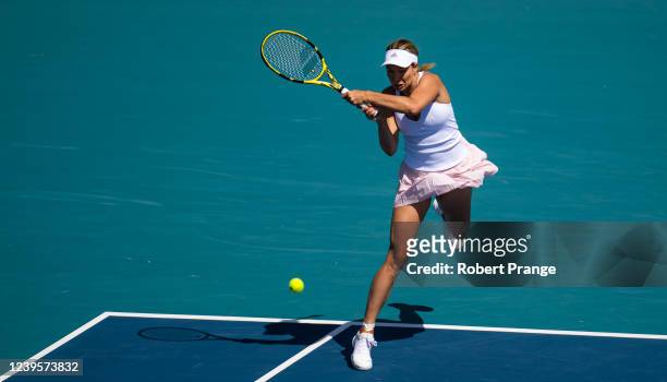 Danielle Collins of the United States hits a backhand against Ons Jabeur of Tunisia in her fourth round match on day 8 of the Miami Open at Hard Rock...