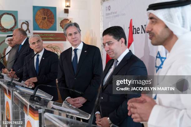 United Arab Emirates' Foreign Minister Sheikh Abdullah bin Zayed Al Nahyan, right, makes remarks at the Negev Summit, with from left, Bahrain's...