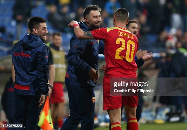 Milutin Osmajic of Montenegro celebrates their side first goal with coach Mirko Vucinic during the International Friendly match between Montenegro...
