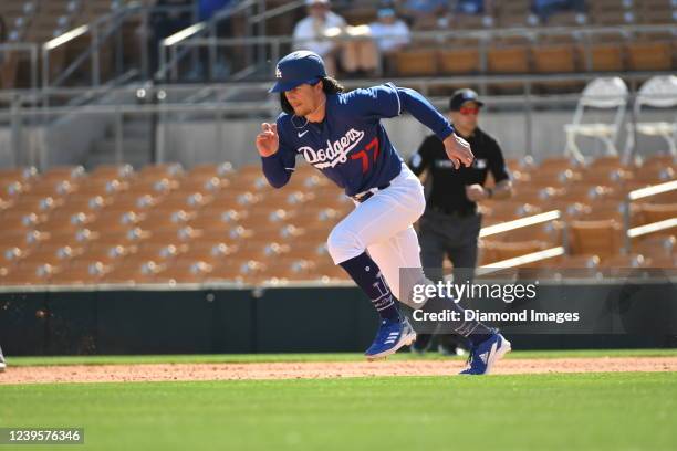 James Outman of the Los Angeles Dodgers runs to second base during the fifth inning of an MLB spring training game against the Cincinnati Reds at...