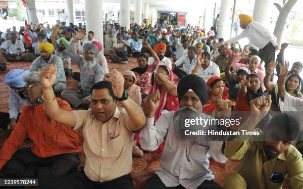 Chandigarh UT employees protest during Bharat Band at Bridge Market on March 28, 2022 in Chandigarh, India. While essential services mostly remained...