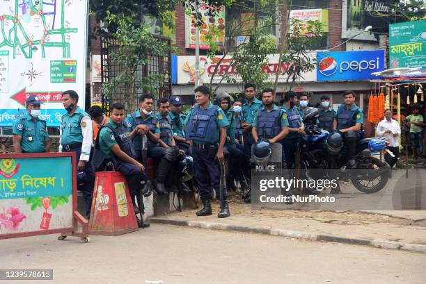 Police stand guard during the countrywide half-day strike in protest against the price hike of essential commodities in Dhaka, Bangladesh, on March...