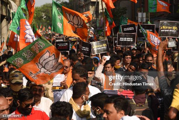 Bharatiya Janata Party supporters along with BJP state president Sukanta Majumdar participate in a protest rally against Bogtui village violence in...