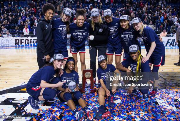 UConn Huskies pose for pictures after defeating the NC State Wolfpack to become Regional Champions during the Elite Eight of the Women's Div I NCAA...