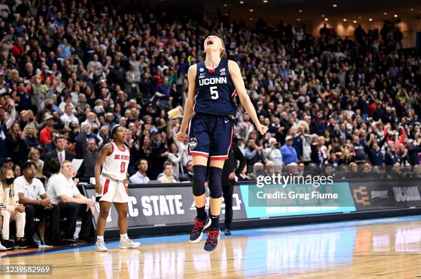 Paige Bueckers of the Connecticut Huskies celebrates after a victory against the NC State Wolfpack during the Elite Eight round of the 2022 NCAA...