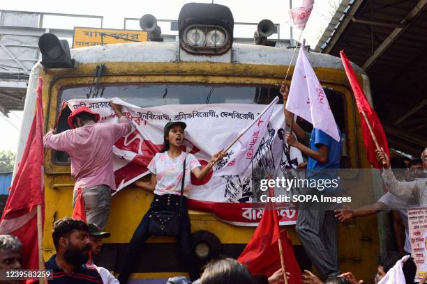 Leftist party workers block the train and shout slogans during the first day of the two-day nationwide strike against the policies of the central...