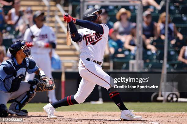 Minnesota Twins outfielder Derek Fisher bats during a spring training baseball game against the Tampa Bay Rays on March 24, 2022 at Hammond Stadium...