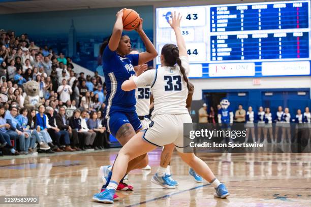 Seton Hall Pirates forward Sidney Cooks looks to pass the ball while being defended by Columbia Lions forward Noa Comesana during the second half of...