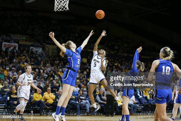 Toledo Rockets guard Quinesha Lockett shoots over Middle Tennessee Lady Raiders center Anastasiia Boldyreva , of Russia, and Middle Tennessee Lady...