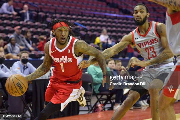 Ahmad Caver of the Memphis Hustle handles the ball ahead of Terrance Ferguson of the Rio Grande Valley Vipers during an NBA G-League game on March...