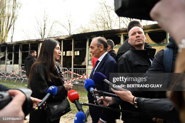 French far-right Reconquete! party President and presidential candidate Eric Zemmour speaks with a former Sevran resident on local living conditions,...