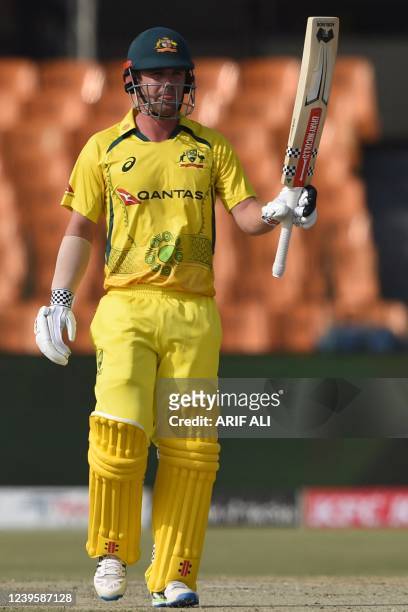 Australia's Travis Head celebrates after scoring a half century during the first one-day international cricket match between Pakistan and Australia...