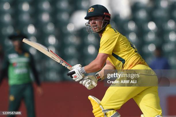 Australia's Travis Head plays a shot during the first one-day international cricket match between Pakistan and Australia at the Gaddafi Cricket...