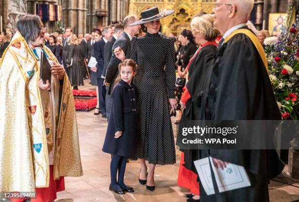 Catherine, Duchess of Cambridge and Princess Charlotte of Cambridge talk to clergy at Westminster Abbey following the Service of Thanksgiving for the...