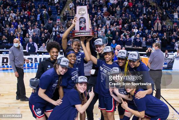UConn Huskies pose for pictures after defeating the NC State Wolfpack to become Regional Champions during the Elite Eight of the Women's Div I NCAA...