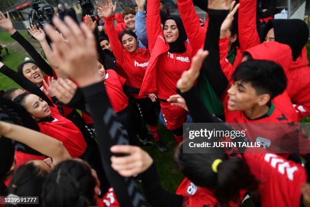 Afghan development team players gather prior to the football match between Afghan development squad and Womens parliamentary team, at the Dulwich...