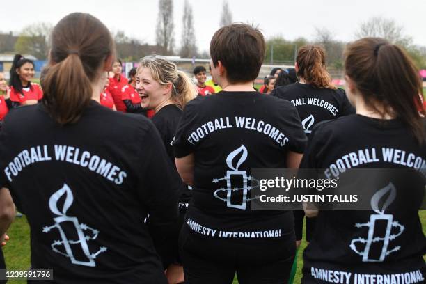 Womens parliamentary team players gather prior to the football match between Afghan development squad and Womens parliamentary team, at the Dulwich...