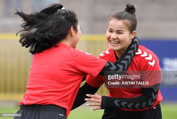 Afghan development squad team players celebrate after scoring a goal during the football match between Afghan development squad and Womens...
