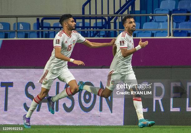 S forward Hareb Abdullah celebrates scoring with teammates during the 2022 Qatar World Cup Asian Qualifiers football match between United Arab...