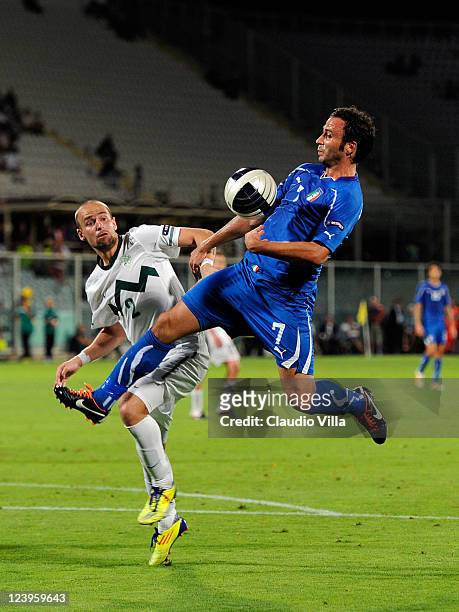 Giampaolo Pazzini of Italy and Miso Brecko of Slovenia battle for the ball during the EURO 2012 Qualifier match between Italy and Slovenia at Stadio...