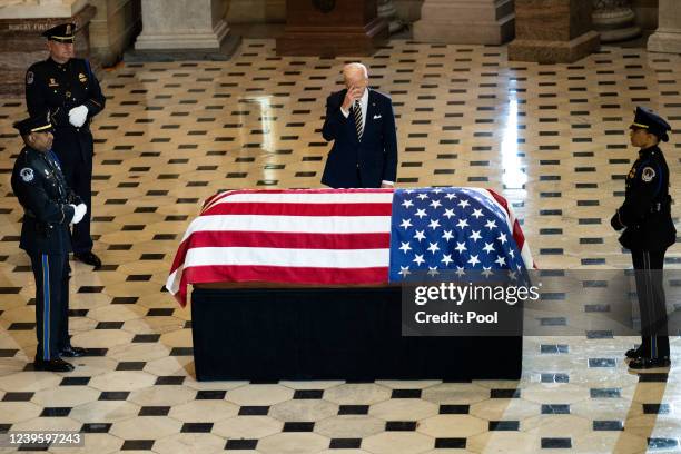 President Joe Biden pays his respects at the casket of Rep. Don Young as Young lies in state in National Statuary Hall at the U.S. Capitol on March...