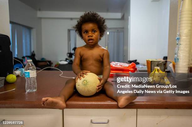 Culver City, CA Aysha-Samon Stokes son Wyatt watches his mom make healthy snacks at home in downtown LA on Thursday, April 28, 2021. With fear of...