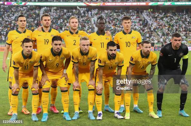 Australia's players pose for a group photo ahead of the 2022 Qatar World Cup Asian Qualifiers football match between Saudi Arabia and Australia, at...