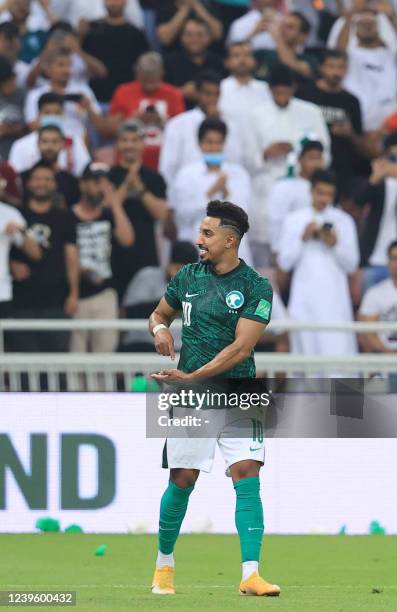 Saudi Arabia's midfielder Salem al-Dawsari celebrates after scoring the opening goal during the 2022 Qatar World Cup Asian Qualifiers football match...