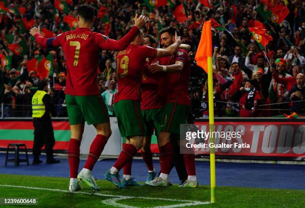 Bruno Fernandes of Portugal celebrates with teammates after scoring a goal during the 2022 FIFA World Cup Knockout Round Play-Off match between...