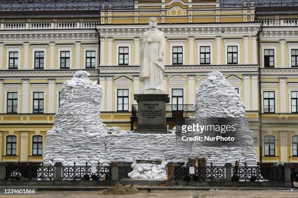 Volunteers cover a monument of the Princess Olga, Apostle Andrew, Cyril and Methodius of sand bags for protection as Russia's invasion of Ukraine...