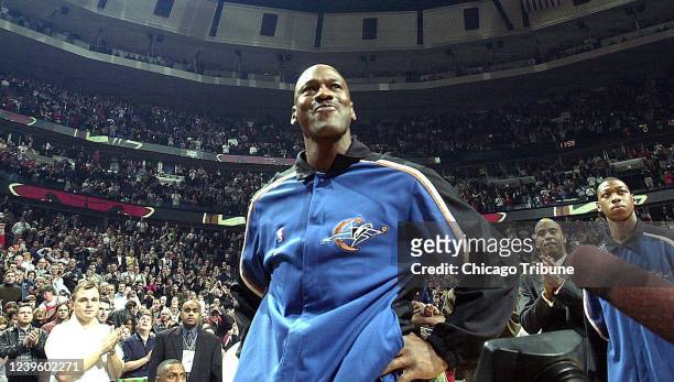 Michael Jordan gets emotional during an ovation after player introductions in his return to the United Center with the Washington Wizards in 2002, in...