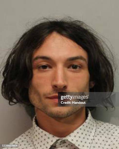 In this handout image provided by Hawaiʻi Police Department, Ezra Miller is seen in a police booking photo after his arrest for disorderly conduct...