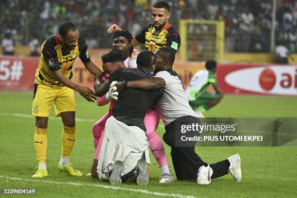 Ghana players celebrate their victory during the World Cup 2022 qualifying football match between Nigeria and Ghana at the National Stadium in Abuja...