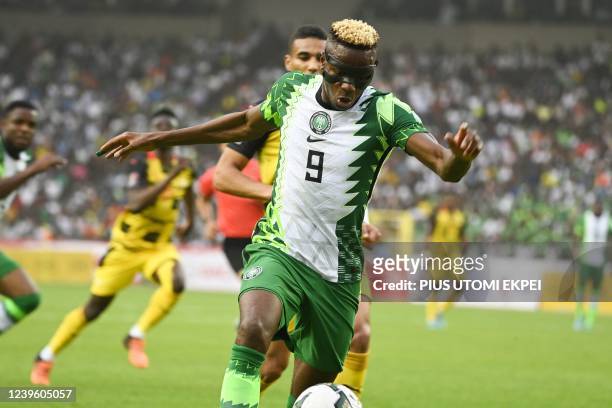 Nigeria's Victor Osimhen controls the ball during the World Cup 2022 qualifying football match between Nigeria and Ghana at the National Stadium in...