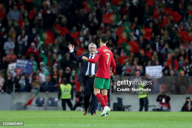 Portugal's forward Cristiano Ronaldo and Portugal's head coach Fernando Santos celebrate the victory at the end of the 2022 FIFA World Cup Qualifier...
