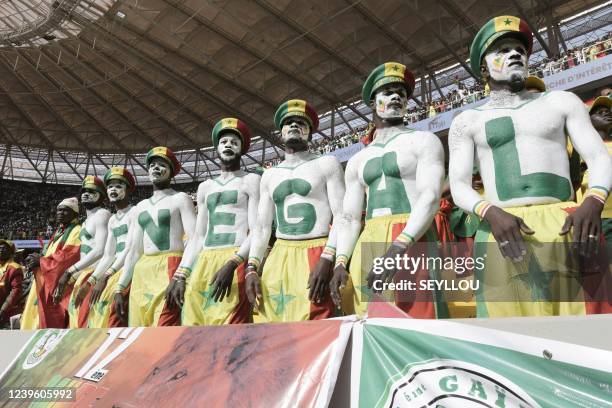 Senegal supporters are seen during the World Cup 2022 qualifying football match between Senegal and Egypt at the Me Abdoulaye Wade Stadium in...