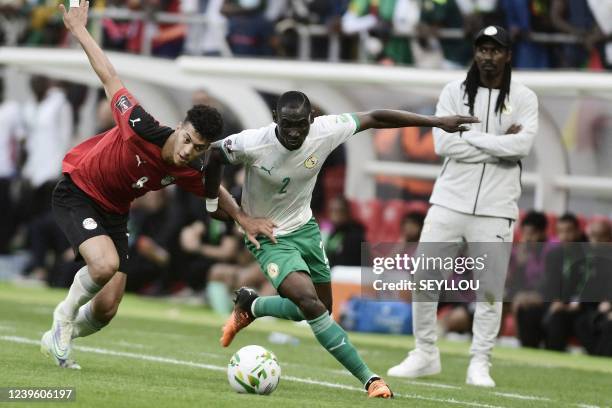 Egypt's Emam Ashour vies with Senegal's Saliou Ciss during the World Cup 2022 qualifying football match between Senegal and Egypt at the Me Abdoulaye...