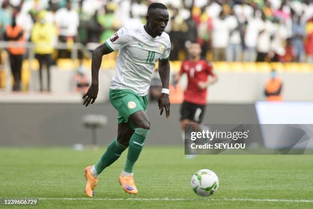 Senegal's Sadio Mane controls the ball during the World Cup 2022 qualifying football match between Senegal and Egypt at the Me Abdoulaye Wade Stadium...