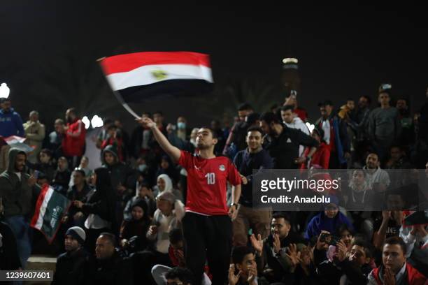 Egyptians follow the FIFA World Cup African Qualifiers 3rd round reverse match between Senegal v Egypt on the giant screens set up in the capital,...