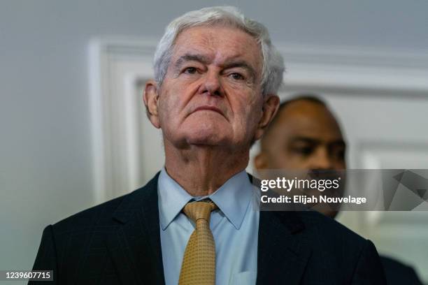 Former Republican Speaker of the House Newt Gingrich looks on as Republican Gubernatorial candidate David Perdue speaks at a campaign event on March...