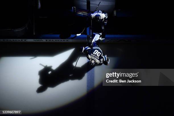 Elvis Merzlikins and Vladislav Gavrikov of the Columbus Blue Jackets skate onto the ice for the first period against the New York Islanders at...