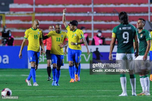 Brazil's Lucas Paqueta celebrates after scoring against Bolivia during their South American qualification football match for the FIFA World Cup Qatar...