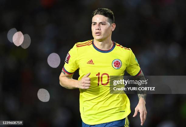 Colombia's James Rodriguez celebrates after scoring against Venezuela during their South American qualification football match for the FIFA World Cup...